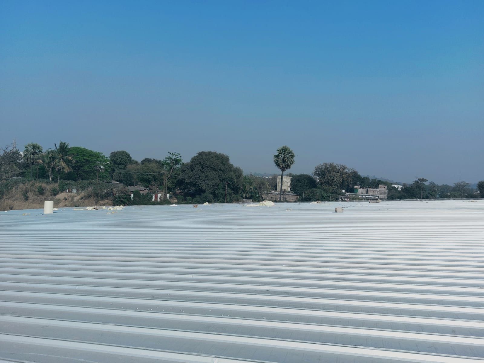 Finished clip lock roof stretching to the horizon under a blue sky