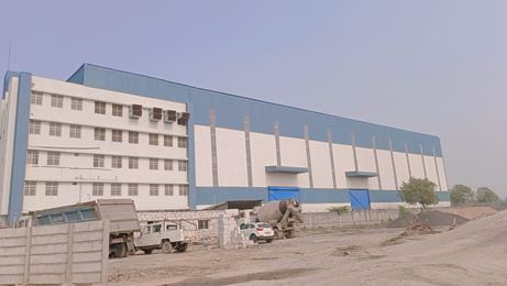 Factory building with a multi-storey office block attached to a steel production shed