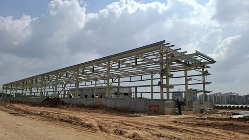 Steel frame of an industrial shed under erection with rafters in place